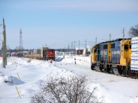 While not as successful as some documenting the CN detours over the Ontario Northland, I did manage to shoot a slightly overcast meet between ONT 313 and detour I912 in Kapuskasing.  Here I912, a 81 platform intermodal train led by CN engines 2605 and 2598, holds the main and waits for 313 to take the siding.  Once clear, I912 would continue eastwards and 313 would work the yard before proceeding to Hearst.