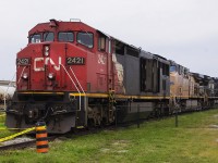 Thanks to Hunter Holmes, who couldn't make the event due to his assignment, my daughter and I had the pleasure to attend CN's Rail Safety Day in September of 2018. This was a good year as just the month before we also were in Sarnia to see VIA's 40th Anniversary train on display downtown at Confederation Park. While my daughter was more enthused by the animals, horse rides and the bouncy castles, I was having a field day living a life long dream. It was so overwhelming being in the midst of CN's operations, standing in the vast Sarnia yard. On a siding, and fenced off to visitors, sits an old 'barn' of sorts in CN 2421 with its doors open. Coupled to it, are a couple of 'FPON' units by way of the Union Pacific and Norfolk Southern railroads. 