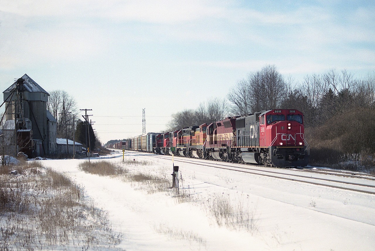Beautiful but cold Monday afternoon out at Copetown. I had heard of a train coming over the detector (mile 15.8)as I was driving along Governor's Rd, which parallels the line, so scurried in at Copetown (approx. mile 10) in order to grab a shot. Nice fresh snow and no one around, so rather than just shoot the train I elected for a scenic shot. Pity the view is a bit backlit, but thats the way it goes. What a nice #394!!!  CN 5618, WC 7518, BNSF 507, 6312, CN 5701, 5603 and 6019. Managed a couple of shots at Hamilton West as well, but much preferred this one. That mill building won't be around much longer by the look of it. Many years ago, the old Copetown station was located here.