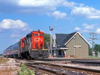 CN 4103 hustles VIA train 165 westward past the station at Ingersoll, mile 59 on the CN's Dundas Sub.