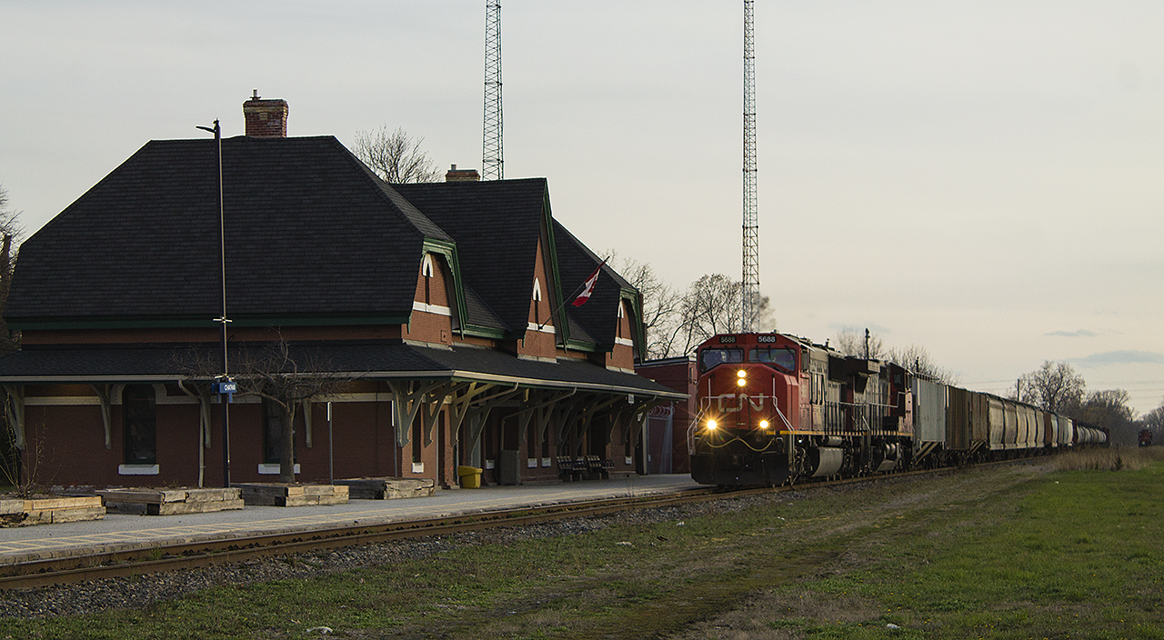 With the current pandemic happening and anything considered 'normal' having been thrown out the window, it was nice to get out and for once score a similarity to hockey's famed "hat-trick". This night's CN train 438, led by 5688 and IC 2465 in CN livery, cruises through comfortably after having lifted some grain cars by Keil Drive. Before this photo I was also able to shoot CP 141, running through Chatham at it's 'new time'. But, my third tally is shown in the distance. Parked in an unusual spot, was Saturday's power for 514 in the old venerable form of GP9 7025. I was surprised that 438 did not lift this engine, although it was gone the next morning by what assume was a lift made by 439 overnight.