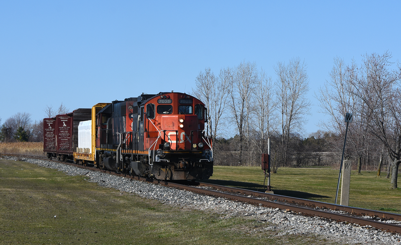 CN's morning local rolls down the jointed rail of the Pelton sub winding its way through town. Prior to CN buying the Pelton where he is now would be the approach to Pelton JCT. where the C&O sub 1 the would have crossed the CASO. Standing the test of time is a C&O era call box where trains would call to get across the diamond.