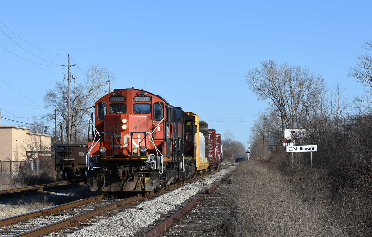 CN's Windsor local rolls down one of the only active sections of the original CASO, passing the gondola interchange with Zalev Brothers scrap.