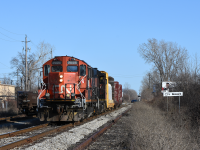 CN's Windsor local rolls down one of the only active sections of the original CASO, passing the gondola interchange with Zalev Brothers scrap. 