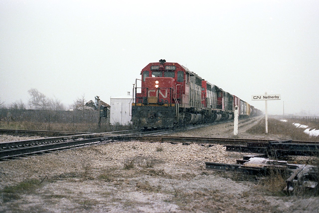 Winter not far off as a trio of CN SD40s leads a train from Fort Erie northward (read: west) to Port Robinson and beyond. Power is CN 5035, 5040 and 5xxx.  The Netherby diamond was removed in the '90s; the line now is only the Welland Tube Spur off a connection a tenth of a mile or so behind me in this pic, running to the right over Hwy 140. Traffic from Martech and the Welland Tube plant is fairly frequent, interchanging with CN Southern Yard. The section removed ran east to CP Brookfield.