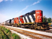 GP9RM's 4125 and 4104 have just come off the CN Humberstone Subdivision and have arrived at CN Nickel Yard for the west bound movement across the Welland Canal over Bridge #20.  The final desitination is the Maple Leaf Mills and Government Elevator (Port Colborne Grain Terminal).  The units are freshly painted and likely originated in Niagara Falls yard.  