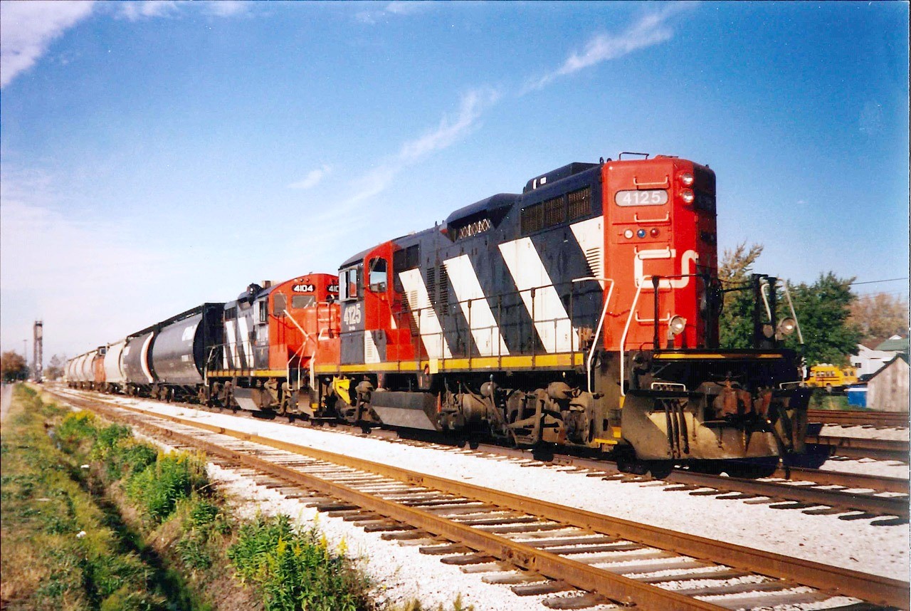 GP9RM's 4125 and 4104 have just come off the CN Humberstone Subdivision and have arrived at CN Nickel Yard for the west bound movement across the Welland Canal over Bridge #20.  The final desitination is the Maple Leaf Mills and Government Elevator (Port Colborne Grain Terminal).  The units are freshly painted and likely originated in Niagara Falls yard.