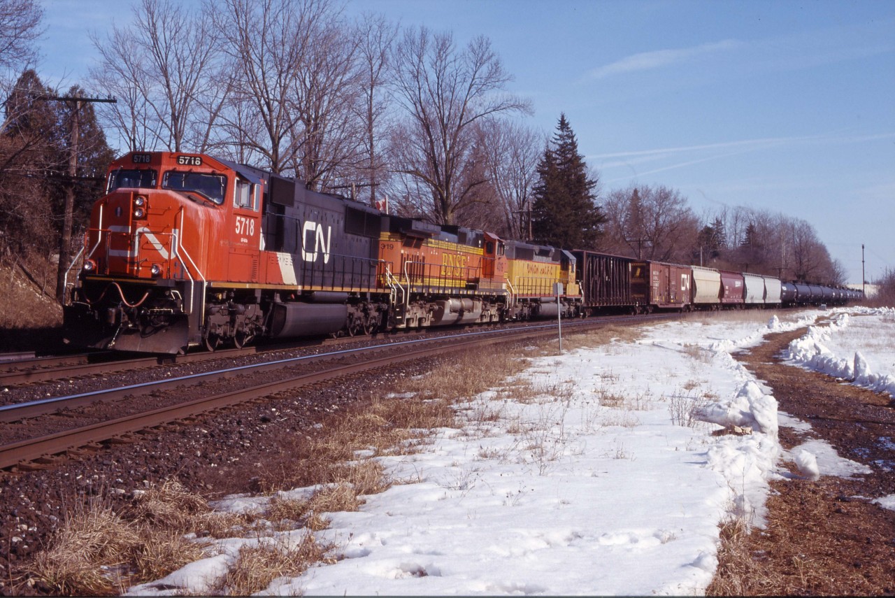 CN 391 waits its turn at Paris Jct. Power is CN 5718, BNSF 4319, and UP 3620.