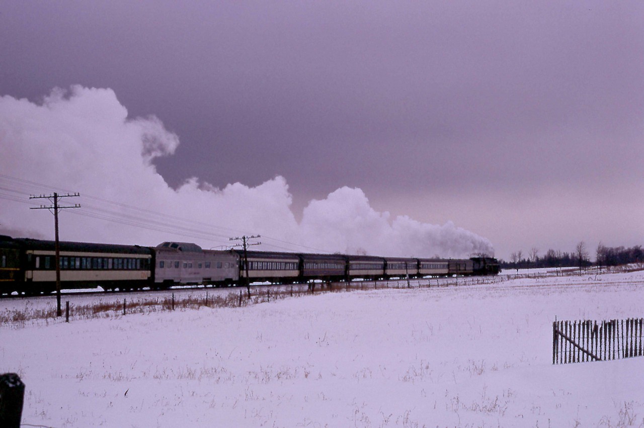 In the waning hours of a cold and blustery Sunday afternoon, the 28th of January 1968, CNR Northern 6218 heads home to Toronto.  Passing Brechin, near Mileage 72 of the Bala Sub, the train has almost completed a circle around Ontario's Lake Simcoe.  The trip, sponsored by the Upper Canada Railway Society, had traversed 98.8 miles of the Newmarket Sub along the west side of the lake to Washago, junction with the Bala Sub.   After that, 88.9 miles down the Bala Sub would bring the excursion train back to Union Station.

The consist featured B&O's Moonlight Dome, which CN leased for Centennial Year and into the early part of 1968.  C&O had ordered the car from Budd for its ill-fated Chessie streamliner in 1946.  Dubbed a Strata-Dome, it featured three drawing rooms, a bedroom and five roomettes.  When delivered in December 1950, it was sold to the B&O and used every other day on the Chicago - Jersey City / Baltimore Shenandoah until October 1963.  It then served as a backup car to mates Starlight Dome and Sunlight Dome on the Capitol Limited.   B&O leased the three cars to the Atlantic Coast Line for use between Richmond and Miami on its Florida Special in 1965-66.  After serving with CN, B&O leased it to the SCL in July 1968 and sold it to them in September 1969.  Again it served on the Florida Special.  

With the advent of Amtrak, the car served until its sale in 1978.  It had a variety of owners until 2014 when Birch Grove LLC purchased the dome and based it in Chicago.