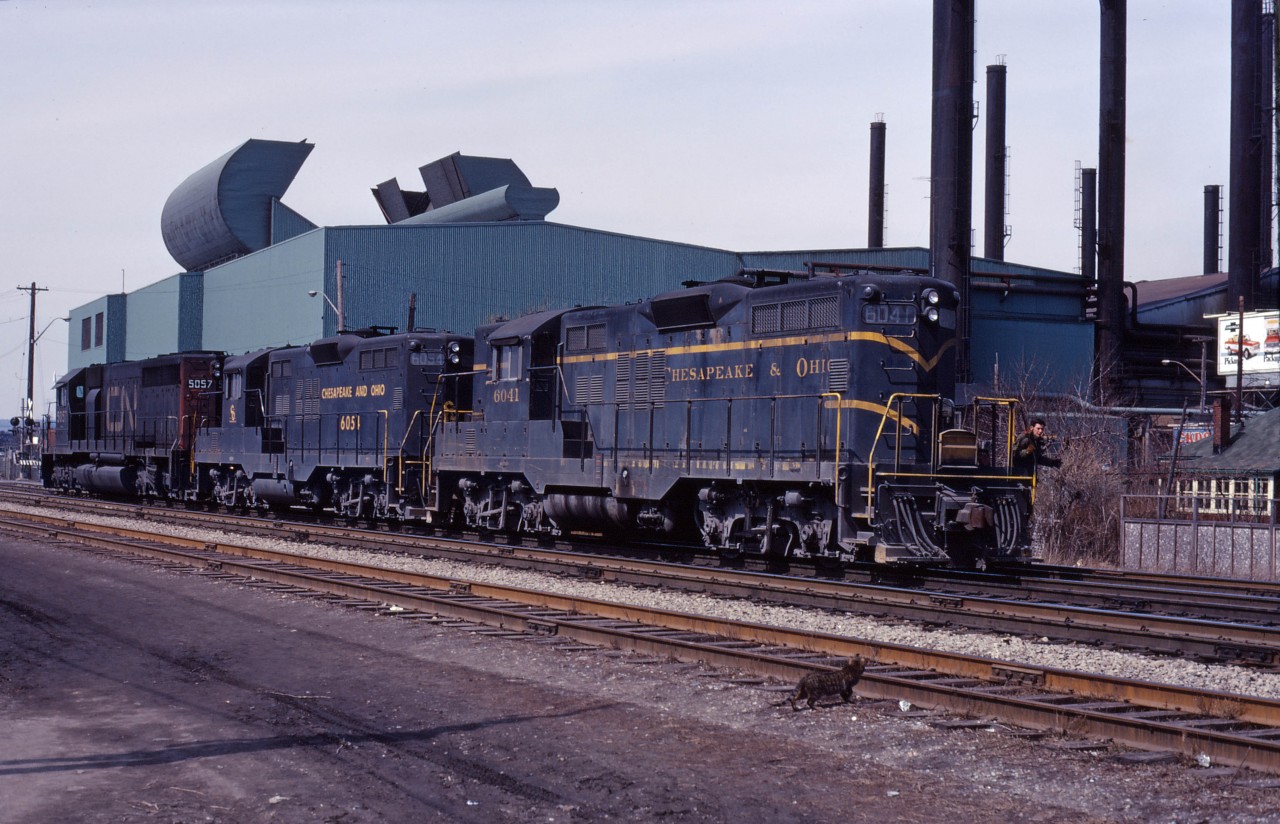 A train from Niagara stops to work at Parkdale Yard in Hamilton. While waiting for delivery of GP38-2s and M420Ws in 1972-73, CN had many C&O GP9s on lease; here we see 6041,6054, and CN SD40 5047.
