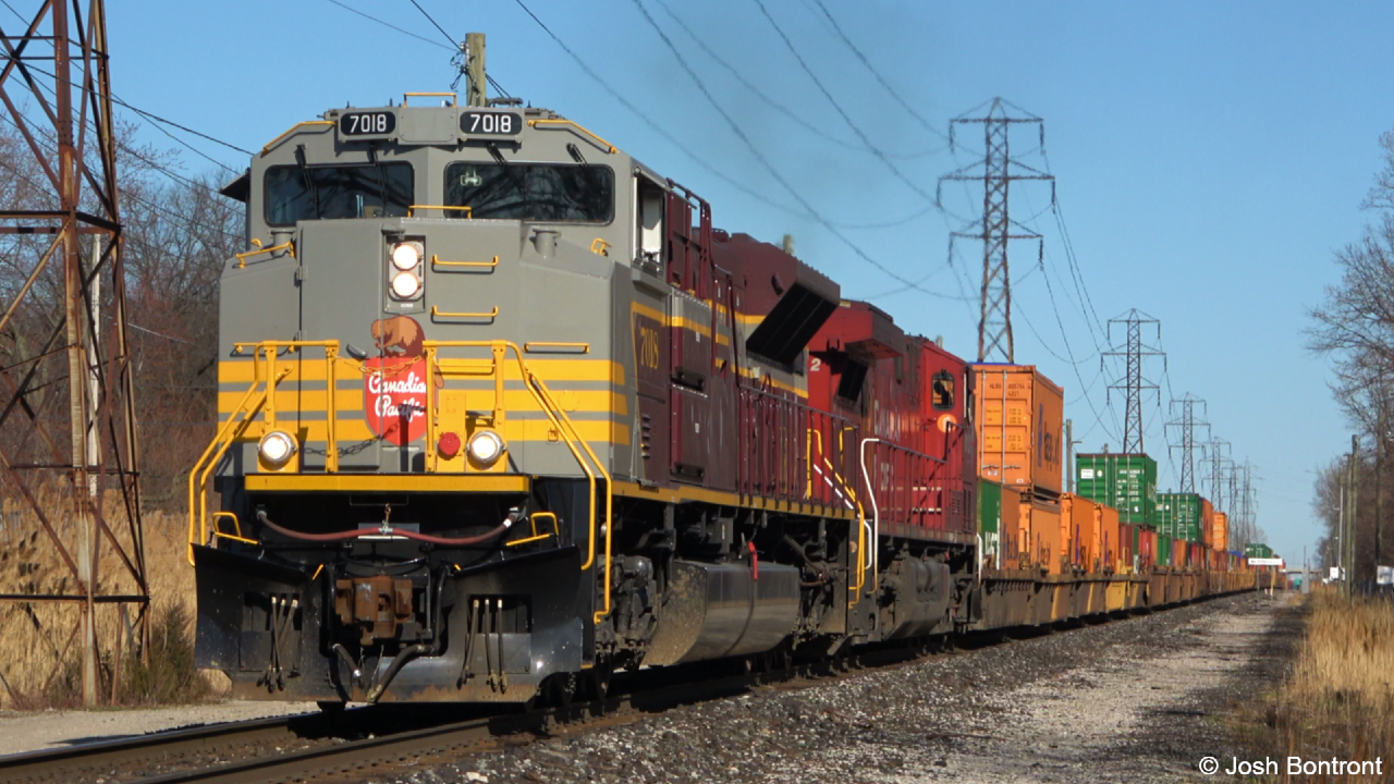 On this gorgeous day we find ourselves just west of the Walkerville JCT mile bored with CP 235 lead by  Heritage Unit, CP 7018 slowly approaching. CP 7018 wears the 1950-60s heritage scheme with block lettering.