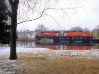 Operating over the former Grand River Railway line, CP GP38-2's 3032 and 3105 on the Toyota Switcher cross the Speed River in Preston, as viewed from Riverside Park nearby.
