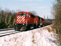 CP train 230 with SD40-2's 5937, 6056 and 5997 approaches Guelph Junction as it slowly rolls through Campbellville and towards the Hamilton Subdivision. According to the 2005 Trackside Guide, dedicated steel  trains 230 and 231 operated between Sudbury and Kinnear yard. At Sudbury the traffic was interchanged with the Huron Central Railway who furthered it to Sault Ste. Marie on their Webbwood Subdivision. Once at Hamilton, the cars were set-off at the Steelcare facility, located at CP's former Aberdeen yard. In later years, the traffic became less dedicated with 230 and 231 being abolished as the steel traffic was then just added to other trains travelling between the two cities. 