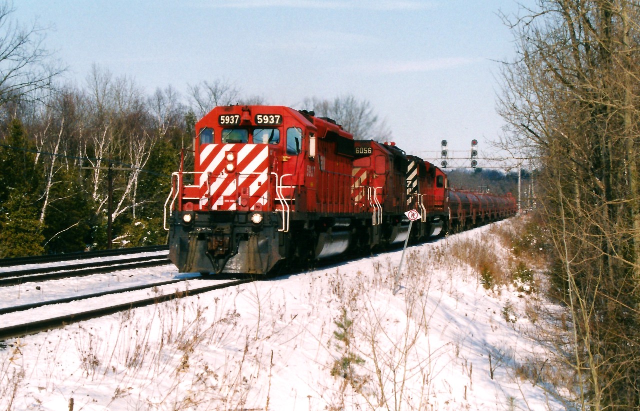 CP train 230 with SD40-2's 5937, 6056 and 5997 approaches Guelph Junction as it slowly rolls through Campbellville and towards the Hamilton Subdivision. According to the 2005 Trackside Guide, dedicated steel  trains 230 and 231 operated between Sudbury and Kinnear yard. At Sudbury the traffic was interchanged with the Huron Central Railway who furthered it to Sault Ste. Marie on their Webbwood Subdivision. Once at Hamilton, the cars were set-off at the Steelcare facility, located at CP's former Aberdeen yard. In later years, the traffic became less dedicated with 230 and 231 being abolished as the steel traffic was then just added to other trains travelling between the two cities.