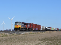 Over the past few days CP 235 has been good to us in Southern Ontario as well to the Detroit locals. Here we see 7018 wearing it's beautiful maroon and grey paint scheme, rolling past some of the many wind turbines that dot Essex county. 