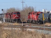 After a morning of CN Clover Bar, I made a stop in at the East Edmonton diamond to see if CP was making a move. As luck would have it, an oil train of empties for Kinder Morgan was approaching with the IOL crew also doing some work. The oil cans were headed up with 4 units, the 8111, 8778, 8784 and 8029. The 8776 was on the tailend. The 4507 and 4419 sat parked for the moment as the IOL crew, on the far left, stood and inspected. The 8111 is just a few car lengths from the diamond, the pink rail joints being on CN's Camrose Sub. The curving track in the immediate foreground is CP's lead into Kinder Morgan.