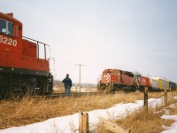 Back in the 1990's Wolverton was always a great place to spend some time as it was near the middle of the OCS section of the Galt Subdivision, it was usually a popular spot for train meets as well as being one of the longer sidings on the line. It was literally just a long siding in the middle of farm fields as the yard was still a decade away from being built. Plus, Trussler Road was less busy with traffic compared to now, so one could have a fairly relaxing wait between trains. Here, CP 8220 and 5403 are on an eastbound in  the siding at the east switch meeting a fast moving westbound with 5583 and 4240 during a Sunday afternoon. 