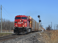 With a quick heads up from a friend East of this location, I packed up my cameras and ladder and made my way out to Belle River. Due to the steep banks right off the sides of the track along the Windsor sub its quite difficult to get a shot where you're not looking up. Here we see a ridiculously early 147 rolling past the signals guarding the West switch of Belle River siding.  