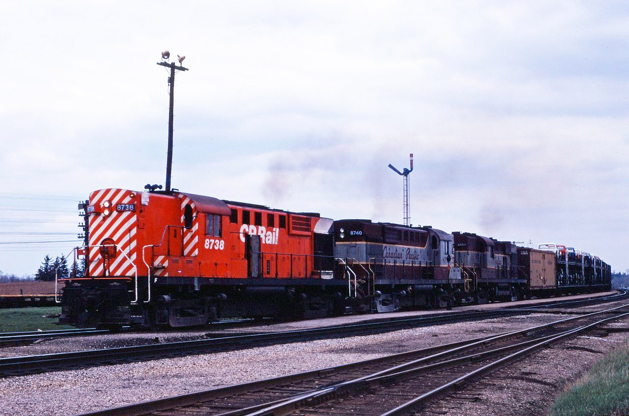 Hard to believe that 50 years have passed since this shot was taken--the processing date on the slide is May 1970! An extra west crests the hill at Guelph Jct behind RS18s 8738, 8740, and steam generator equipped RS10 8464.