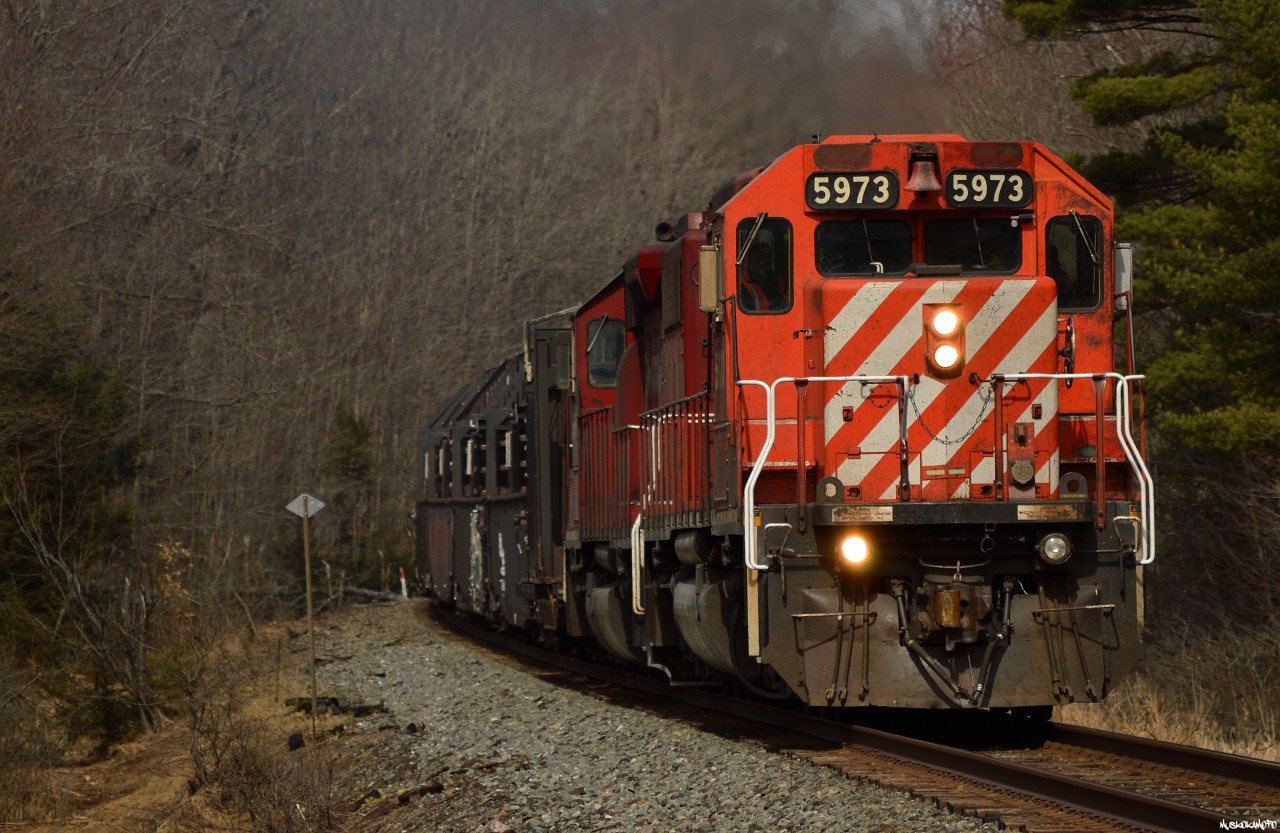 After meeting train 119 at Brignall, CWR-06 is sounding off for Lake Joeseph road on the home stretch about 5 miles from a quick crew change at MacTier, before carrying onto Toronto with rail for the Northeast US.