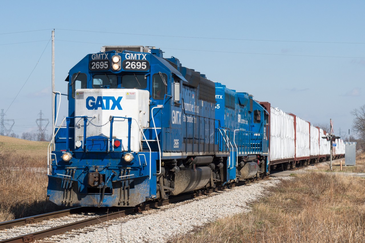 CN L580 slowly trundles through the 10mph slow order at Mile 22 of the Hagersville Subdivion on their way back to Brantford after working the CGC Plant in Hagersville and Nicholson and Cates Lumber in Caledonia.  Presently the CN mega gang is on the line replacing some 6000 ties to help remove some of the many speed restrictions on the line.  Photo taken at 16:00hrs...for those keeping track.