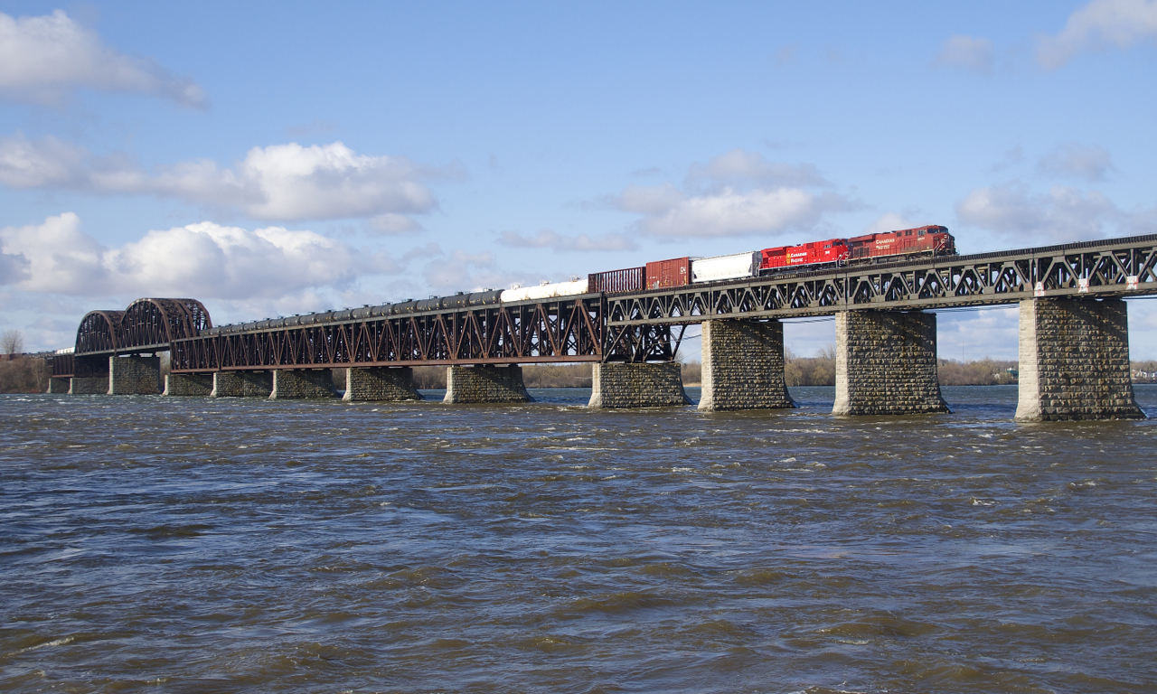 CP 253 is crossing the choppy waters of the St. Lawrence River on a windy morning with CP 8836 and brand new rebuild CP 7035 trailing.