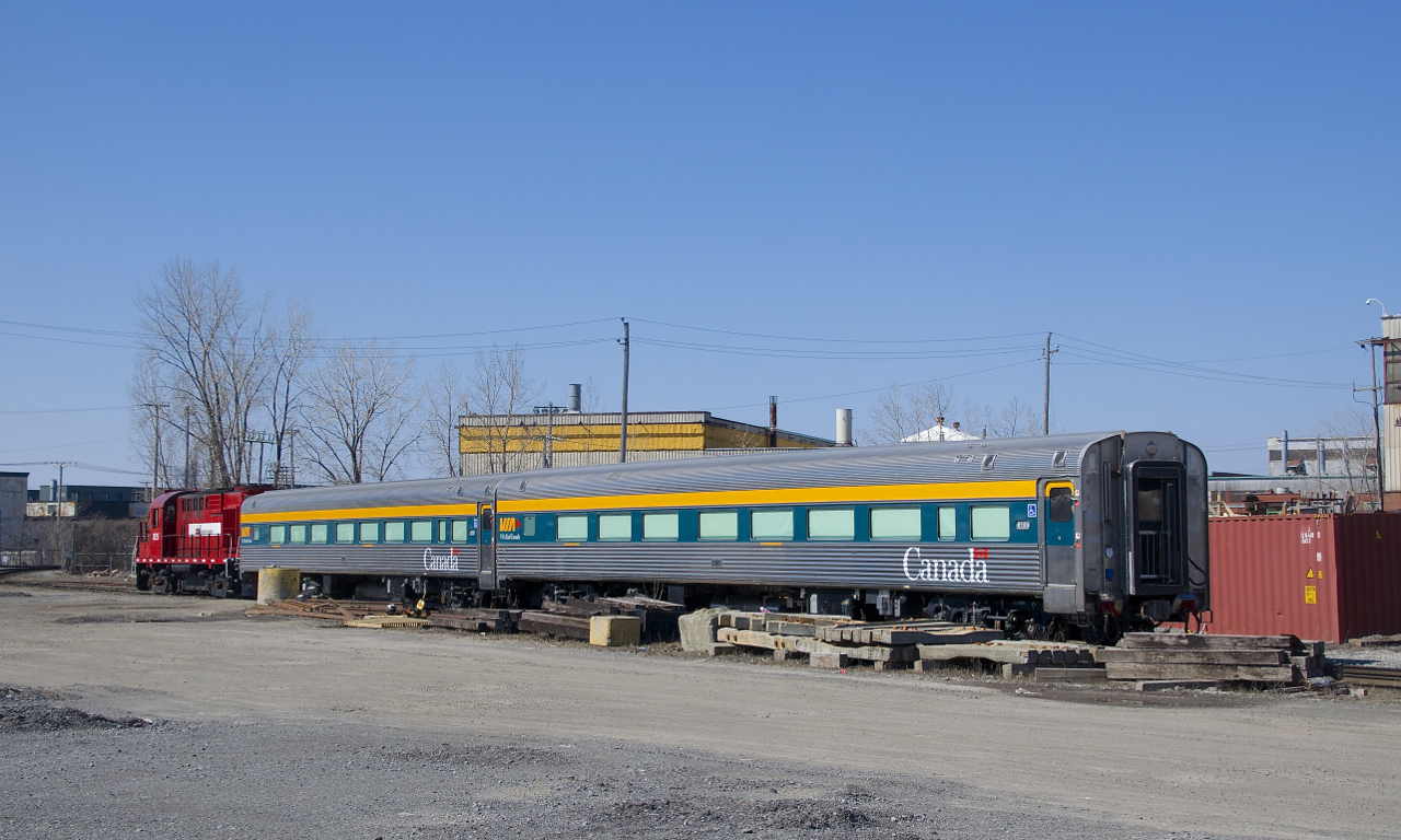 A pair of refurbished VIA Rail coaches (VIA 8109 & VIA 8100) is coupled to CAD 1825 (an ex-CP RS-18), I believe a VIA Rail engine was about to pick them up to bring them to the Montreal Maintenance Centre.