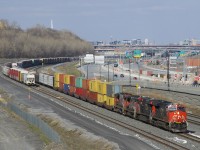 CN 401 with CN 3040, CN 3811, CN 4760 and CN 4769 is passing a long string of parked cars that are on Track 29 of CN's Montreal Sub as it approaches Turcot Ouest.