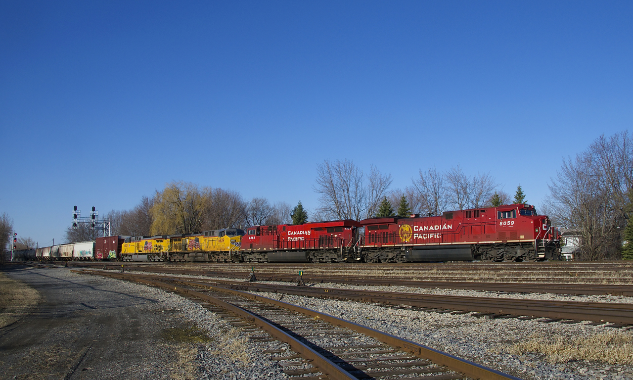 CP 253 has CP 8059, CP 9363, UP 6629, UP 6853 and a whopping 161 cars as it passes Lasalle Yard on a sunny but below freezing morning. The leader was rebuilt from CP 9500, CP's first AC4400CW.