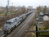 Air Force unit CP 7023 brings up the rear of empty ethanol train CP 651 as it passes North Jct.