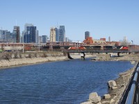 CN 519 is crossing the Lachine Canal with CN 8102, CN 2108, CN 2229, CN 2618 and one hundred corn loads for St-Hyacinthe. These cars had arrived in Montreal on CN 894 on March 30th and were staged on Track 29 of CN's Montreal Sub until CN 519 picked them up there. 