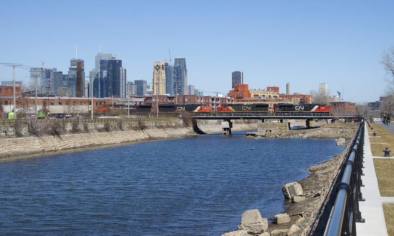 CN 519 is crossing the Lachine Canal with CN 8102, CN 2108, CN 2229, CN 2618 and one hundred corn loads for St-Hyacinthe. These cars had arrived in Montreal on CN 894 on March 30th and were staged on Track 29 of CN's Montreal Sub until CN 519 picked them up there.