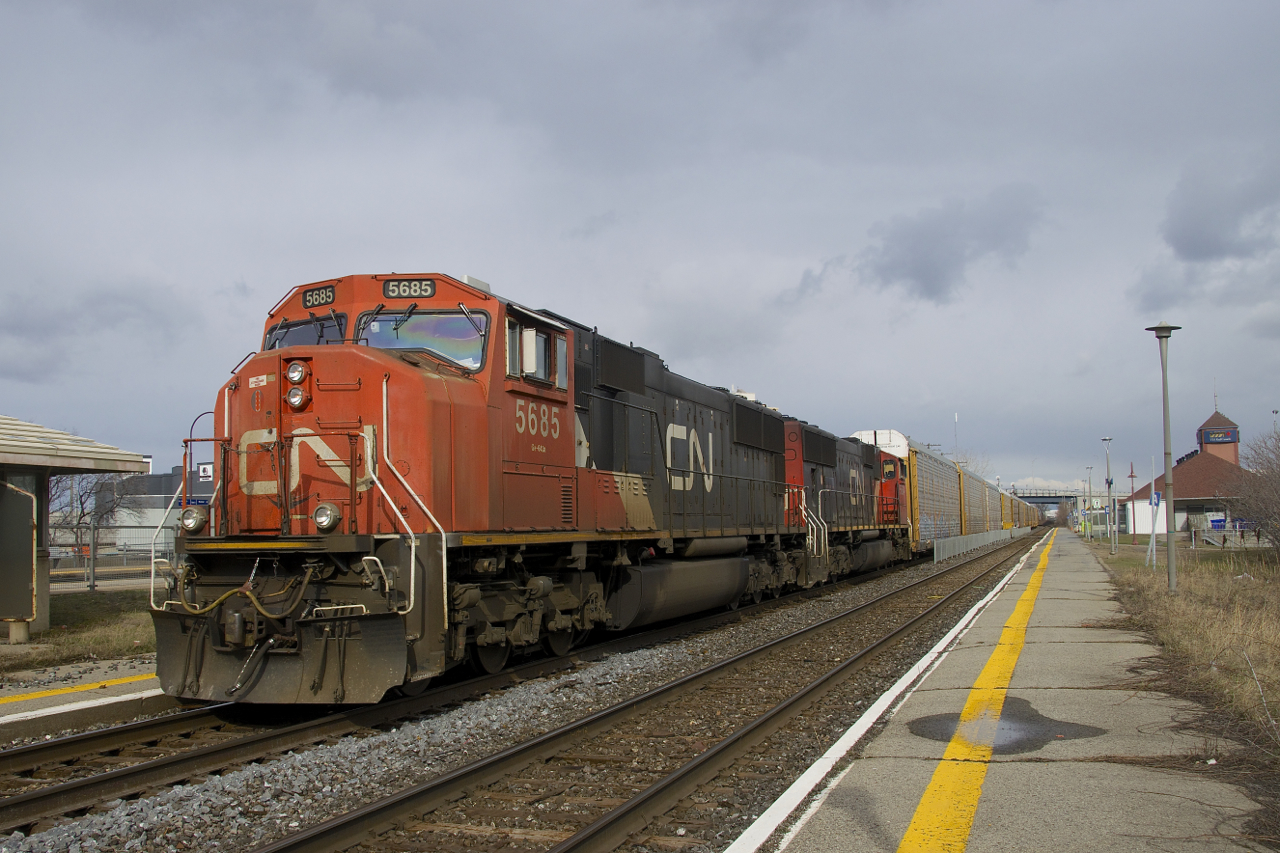 Autorack train CN 271 is passing through Dorval during a brief period of sunshine with EMD's CN 5685 & CN 5604 for power.