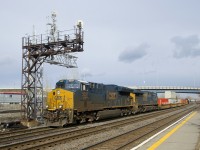 CN 327 has CSXT 3337 and CSXT 728 for power as it heads through Dorval with 6 intermodal cars up front, followed by mixed freight.