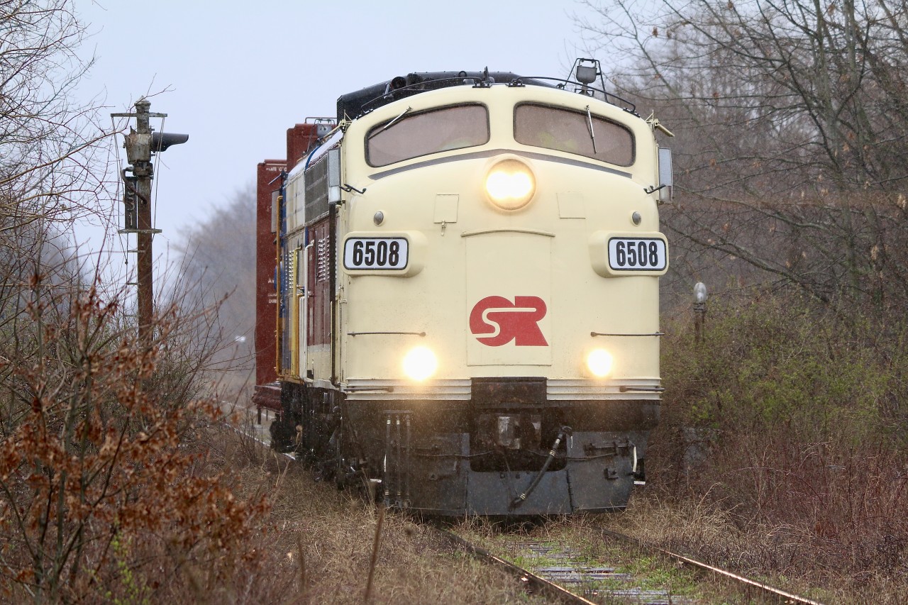 Tillsonburg was once so rich with railroad history, with lines from CNR, CPR and he Canada Southern all running through town.by the end of the 1980's the CPR Port Burwell subdivision was cut back from Port Burwell to Tillsonburg. The CNR Burford subdivision was cut back too, leaving Tillsonburg and being severed at Burford. The late 1990's would claim the east end of the Cayuga subdivision ending it at Delhi and severing it as a through route. The Canada Southern in the mid 1980's would loose its Conrail control and end up being split up between CN and CP, ultimately loosing all through traffic by the 1990's with the loss of the last CSX trackage rights trains at that time. The line was at that time discontinued and CN and CP simply waited for permission to abandon most of the line. In the end OSR purchased what remained of the Port Burwell subdivision and Trillium got the surviving section of the Cayuga subdivision. When Trillium gave up the Cayuga sub. CN took it back and leased it to the OSR but now OSR is getting out of the lease and the future looks grim as CN has no interest in keeping the line, as a lot of bridges need rebuilding along the route. April 23, 2020 was a somber grey day as OSR's two "F" units retraced the route once used by not just CN but Wabach F7's. The previous week a lone centre beam was left at a lumber yard east of Tillsonburg so the power made the very last trip in the driving rain to retrieve it, most likely making history as the last train to operate past the one time advance signal for the long abandoned CPR diamond with the Port Burwell subdivision just ahead.