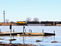 With about 30 tanks in tow ETR 107 crosses over the main branch of River Canard on it's way to Amherstburg and the most Southern rail served industry in Canada. 
