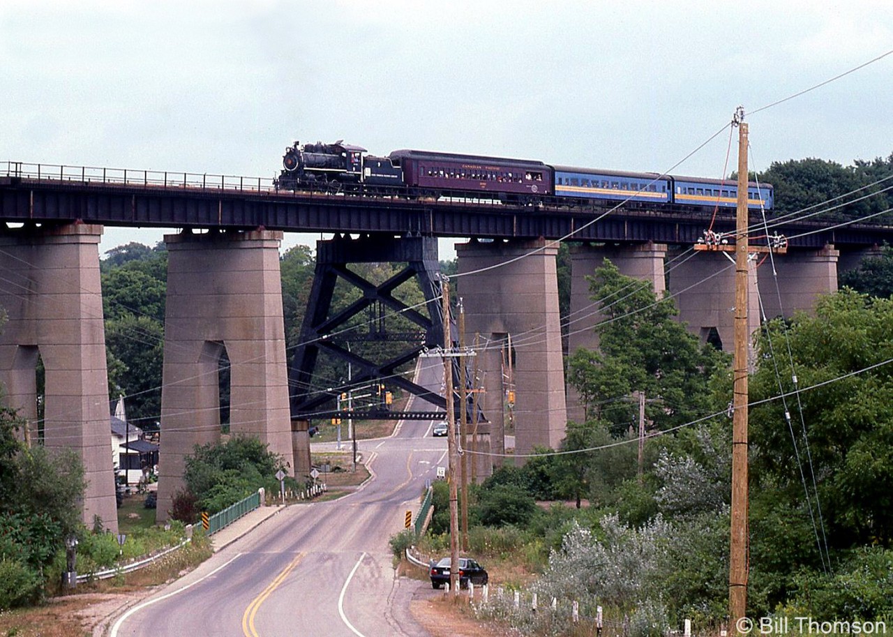 Essex Terminal Railway 9, operating during the Elgin County Railway Museum's Iron Horse days on August 24th 2002, is seen crossing the old CASO Kettle Creek bridge at the west end of St. Thomas. The line has since been taken up, but the bridge remains and there is a push to turn it into an elevated park.