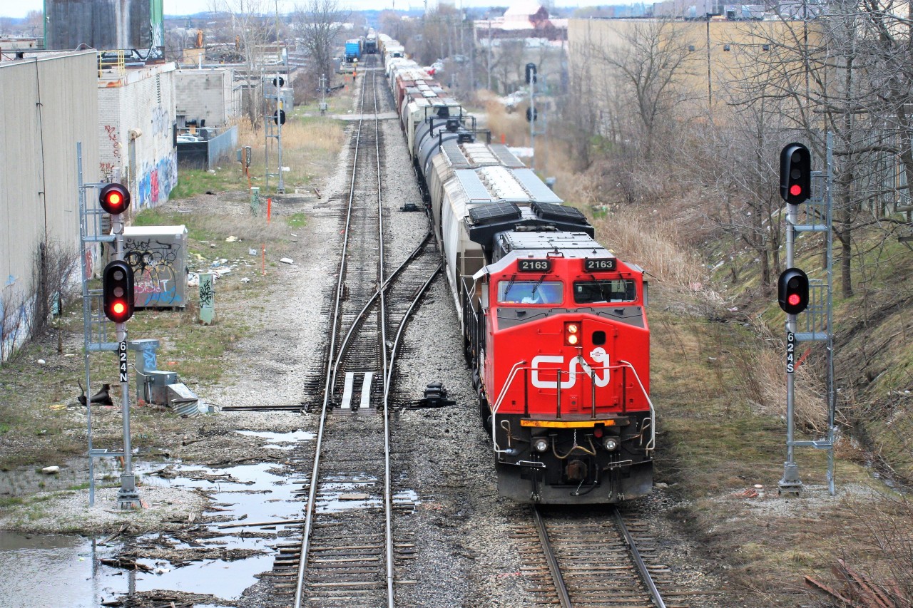 CN A431 with 2163 arrives from MacMillan yard in Toronto to set-off and lift in Kitchener. The train would also lift three units at Kitchener before departing eastward. April 27, 2019.