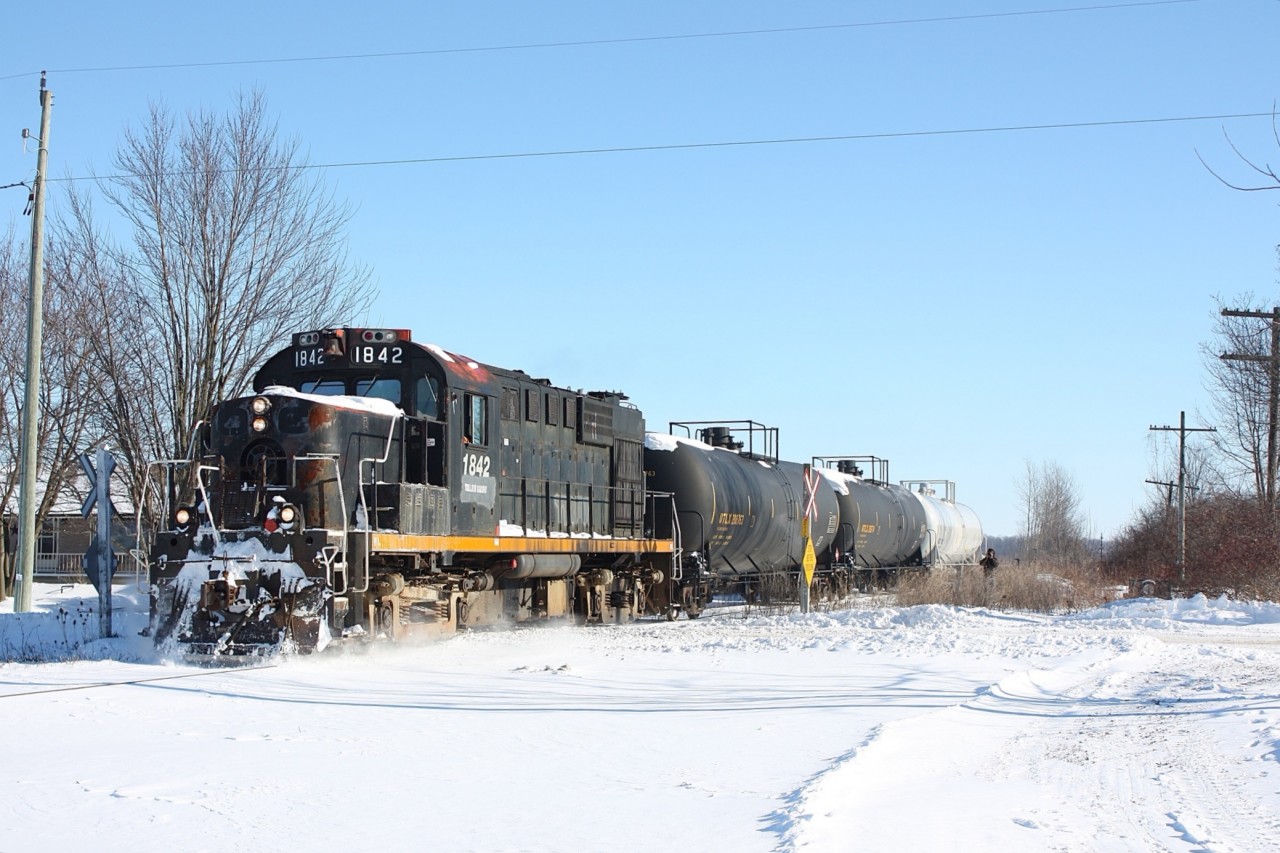 With all the focus on time running out for OSR's operations over CN's Cayuga subdivision it seemed like a good time to go back to late 2013 when Trillium's St. Thomas Eastern only had days left. At the time most figured the line would soon vanish but luckily CN found a new operator, and by 2016 trains were once again operating over the line. In 2020 the line once again finds itself in the same situation, the only difference is this time the line is running out of chances. Here we see one of the last STE trains crossing the abandoned one time CN / CASO diamond just east of St. Thomas with a former CP RS-18 in charge. Note that both CP red and Ottawa Central lettering is showing through.