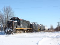 With all the focus on time running out for OSR's operations over CN's Cayuga subdivision it seemed like a good time to go back to late 2013 when Trillium's St. Thomas Eastern only had days left. At the time most figured the line would soon vanish but luckily CN found a new operator, and by 2016 trains were once again operating over the line. In 2020 the line once again finds itself in the same situation, the only difference is this time the line is running out of chances. Here we see one of the last STE trains crossing the abandoned one time CN / CASO diamond just east of St. Thomas with a former CP RS-18 in charge. Note that both CP red and Ottawa Central lettering is showing through.