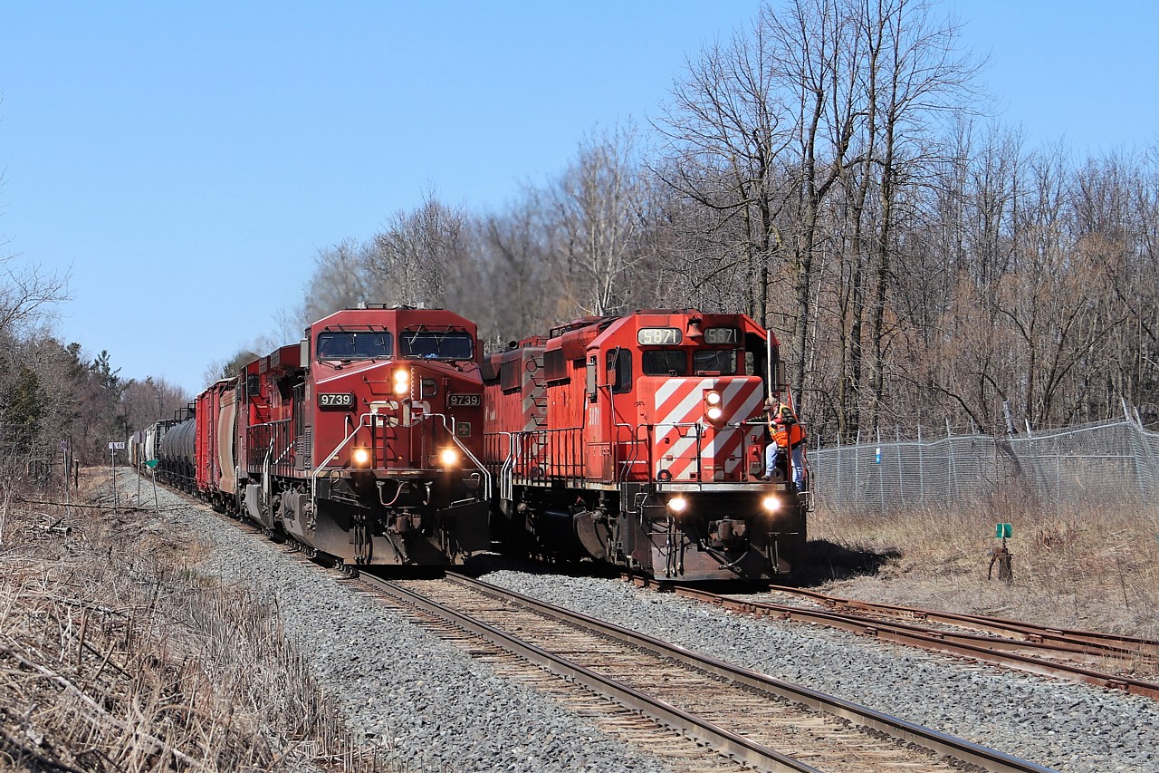 This is a rare occasion and I have to thank a fellow rail fan for informing me of this meet. The Waterdown spur is very seldom used anymore so having a train in it is quite rare. To top it off, we have the CWR train with SD40-2, CP 5871, idling away in the siding waiting for two CP trains to come southbound so they can continue to lay rails. This is the meet with CP 246, led by CP 9739 as it made its way towards Hamilton for work at Kinnear.  CP 254 would follow it down in about forty-five minutes.