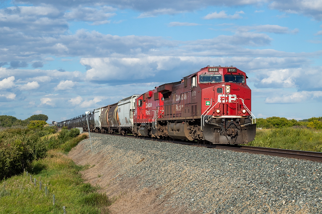 I was exhausted after a long day of railfanning, and was heading back to Saskatoon to eat and catch up on some sleep. I was eastbound along Highway 14 when I saw this unknown westbound CP freight, so I did what any exhausted railfan would do, and turned around and started back west on the highway until I was comfortably ahead enough to pull off the highway in a pocket of sun for a shot.