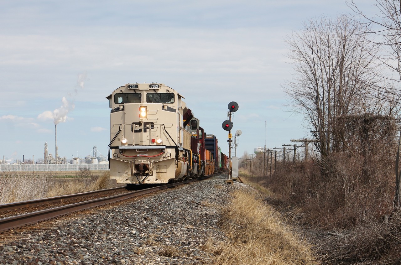 CP 235 passes the signals at WSS Ringold, preparing to pound the diamond with VIA Rail's Chatham Subdivision behind the frame. 235 featured one of CP's SD70ACUs painted to commemorate Canadian and US veterans, and various branches of the military.