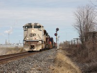 CP 235 passes the signals at WSS Ringold, preparing to pound the diamond with VIA Rail's Chatham Subdivision behind the frame. 235 featured one of CP's SD70ACUs painted to commemorate Canadian and US veterans, and various branches of the military.   
