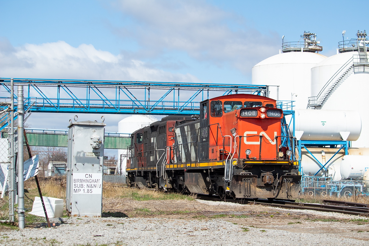 The 0800 Yard Job had just crossed over the diamond at Irondale, and is about to cross Birmingham Street as it continues eastward to grab cars from the interchange - a trip necessitated by the need to lift some Toronto Tank Lines (TTL) cars they needed to build the train for the evening crew's trip over to Eastport. If you squint hard enough, you can see RP contributor/moderator Michael Da Costa in the engineer's seat. Aside from Michael, you can also see a severed rail into Air Liquide. I have heard that there are plans to reinstall this switch.