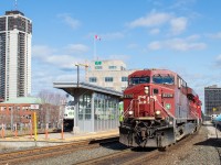 On a nice spring afternoon, CP 255 with the 8779 North heads past the old TH&B (now GO) Station in downtown Hamilton.