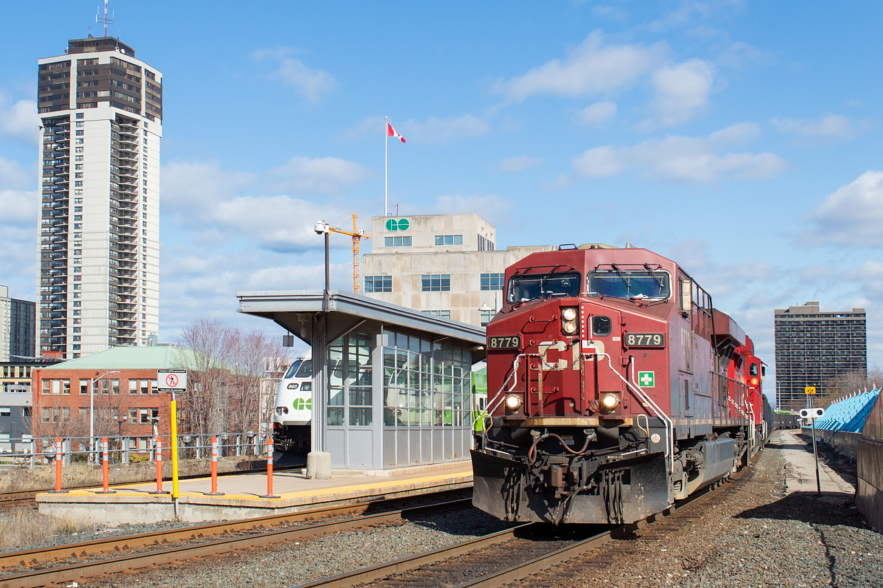 On a nice spring afternoon, CP 255 with the 8779 North heads past the old TH&B (now GO) Station in downtown Hamilton.