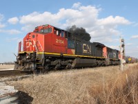 After CN M398 was done making their lift and backed up into the yard, CN M331 had their light at Blackwell to proceed into the yard with CN 2154 filling the blue skies with black smoke.