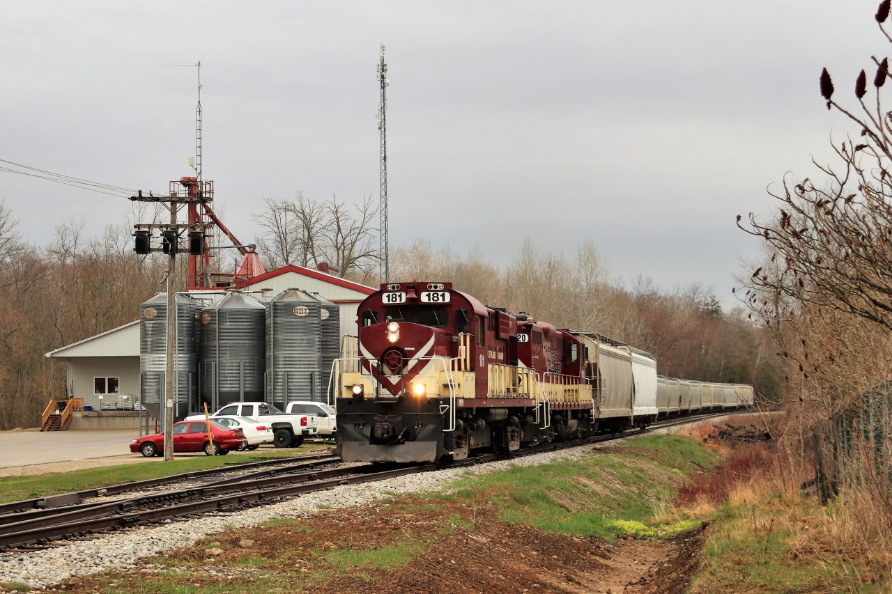 I had went to Guelph Junction to check out what was up and saw the OSR getting ready to depart Guelph Junction so off I went to photograph them on the way to town. Getting them is a tough job in the sun so light rain and overcast skies aided the picture but not me. OSR 181 with OSR 1620 rumble along the bolted rail entering the village of Moffat as they pass the Sharpe feed store.