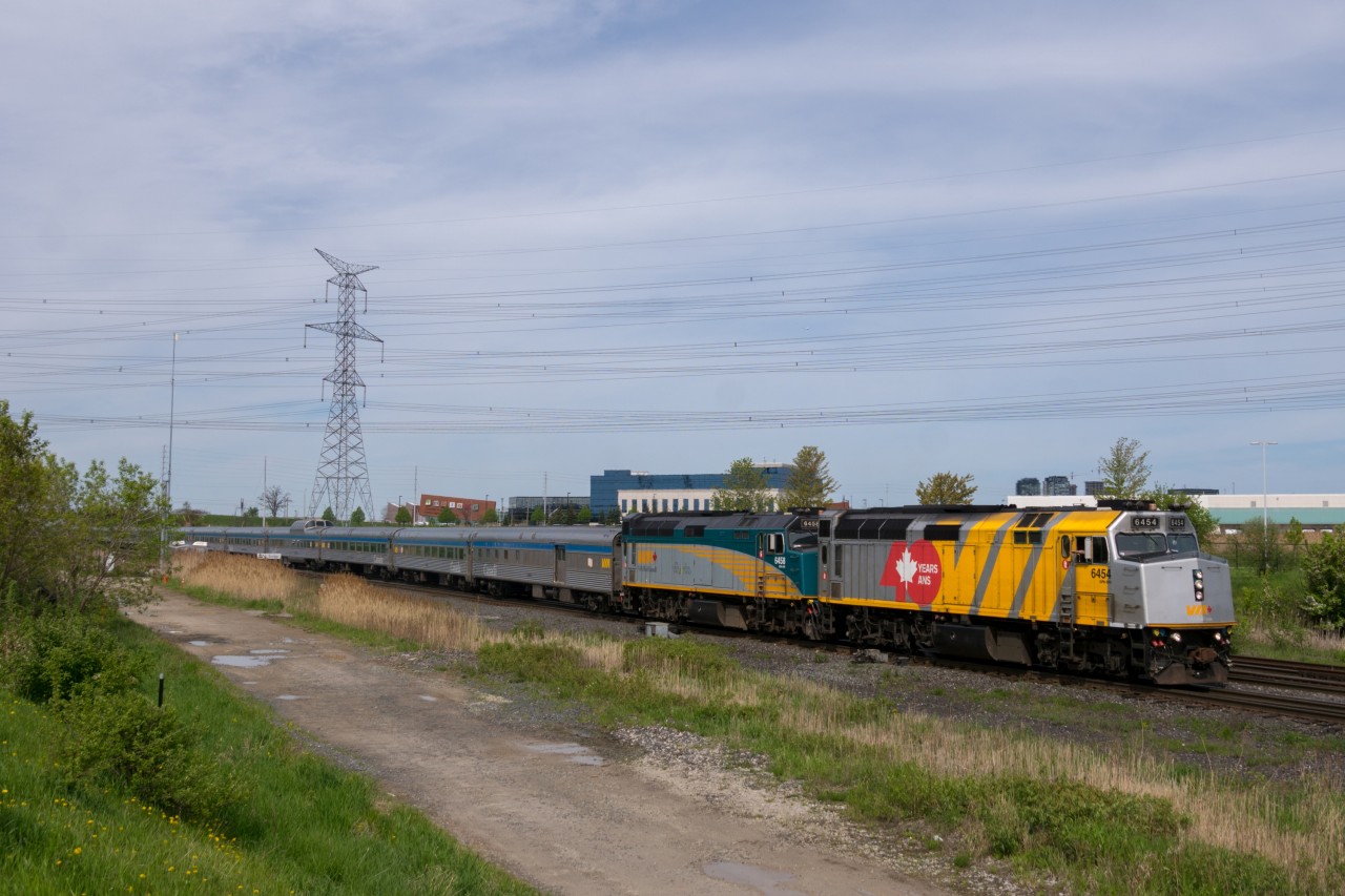 When VIA unveiled its wraps for Canada 150 in 2017, the splash of extra colour was a welcome sight across the country. To celebrate the 40th anniversary of VIA Rail Canada in 2018, the wraps were modified, as seen here. With a friendly wave from the seasoned engineer, VIA number 1 crosses from York 1 to the south track to head east towards Doncaster and points north.

 6454 at Oriole in 2017 
 6454 at Sunnyside in 2017